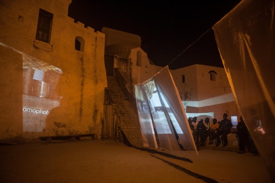 “Sankɔfa Hauntings, Ghosts of a Futures Past” Installation view outside door of no return Cape Coast Castle, 2015 image by image by Desire Clarke